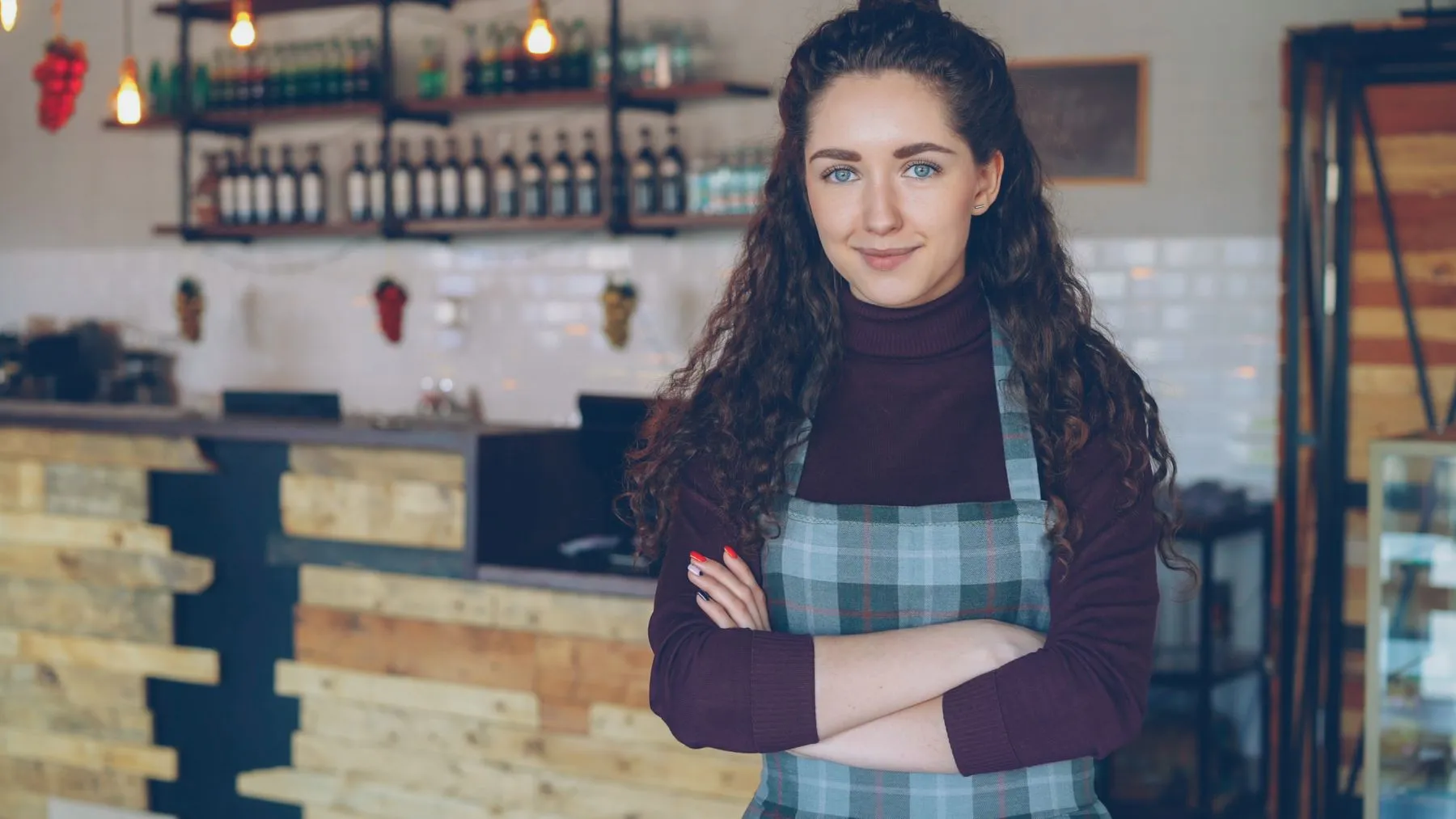A small business owner standing in her shop
