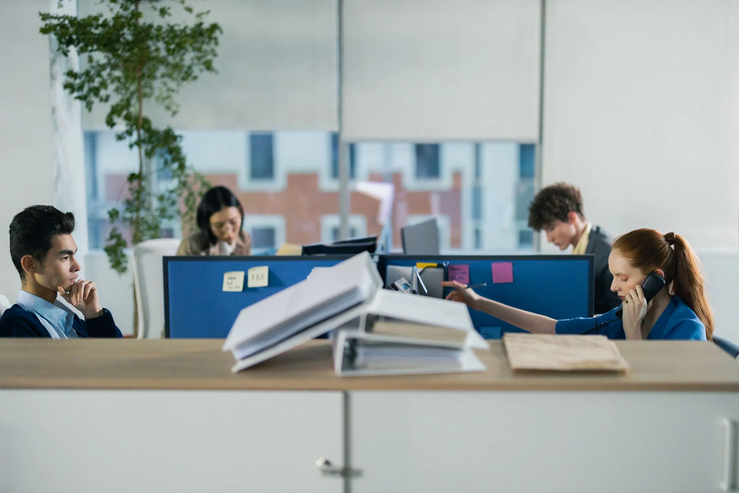 People working at desks in a shared office