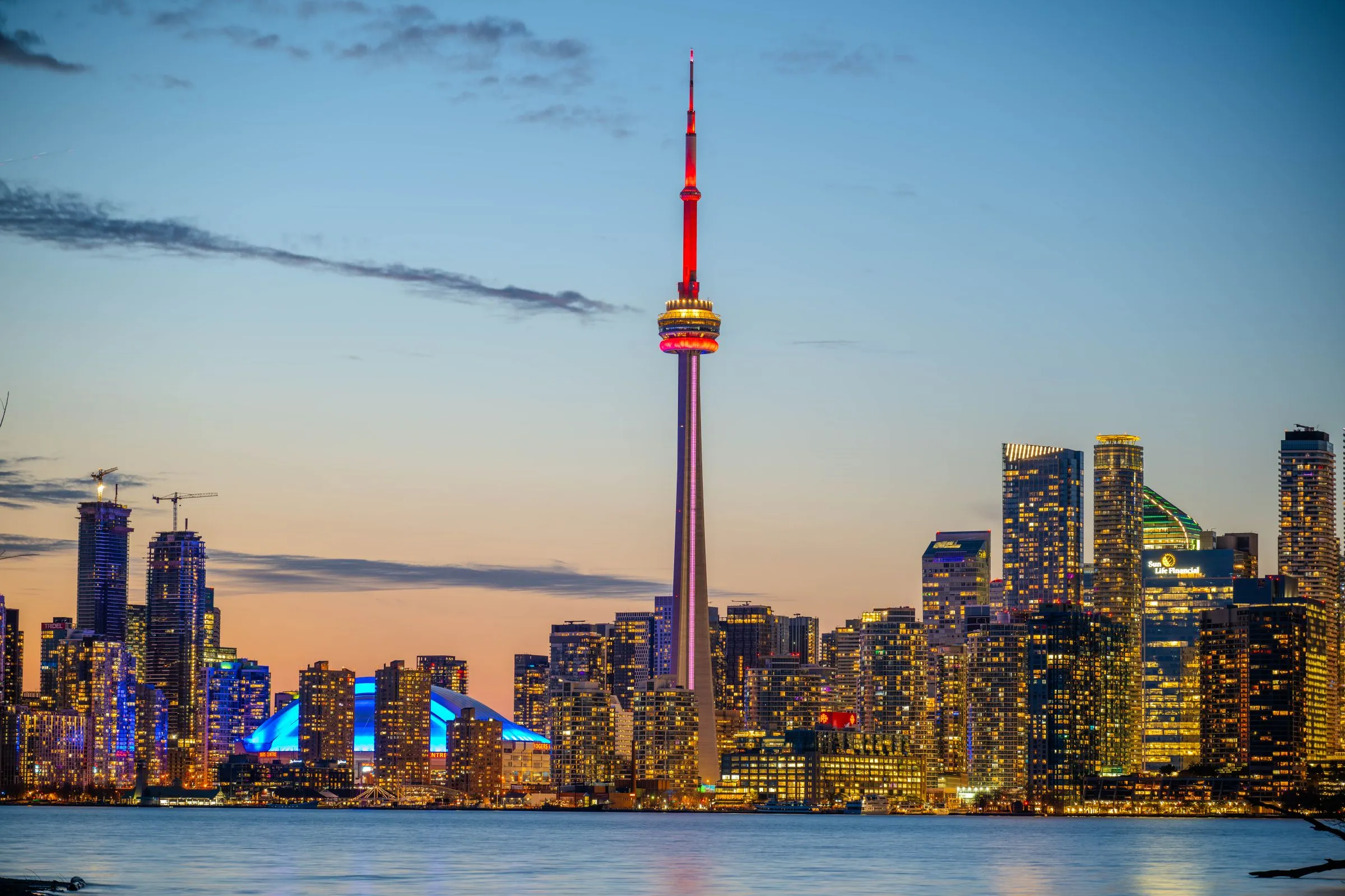 The CN Tower and Toronto skyline lit at dusk