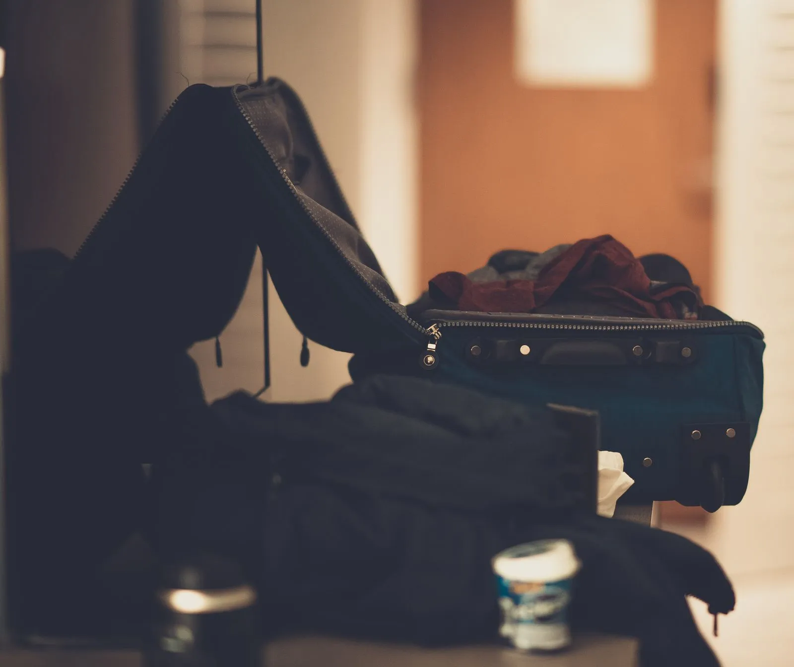 A packed suitcase by a doorway